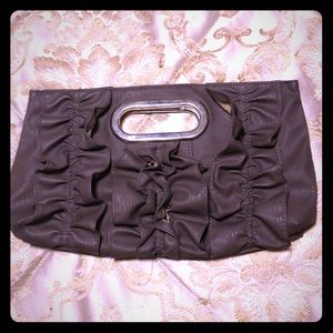 Gray frilly clutch with cut out